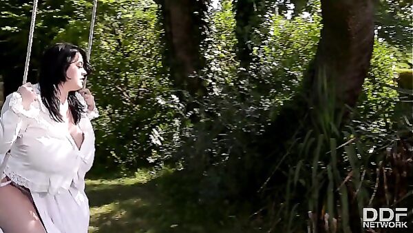 Leanne Crow: Topless Garden Tease on the Swing